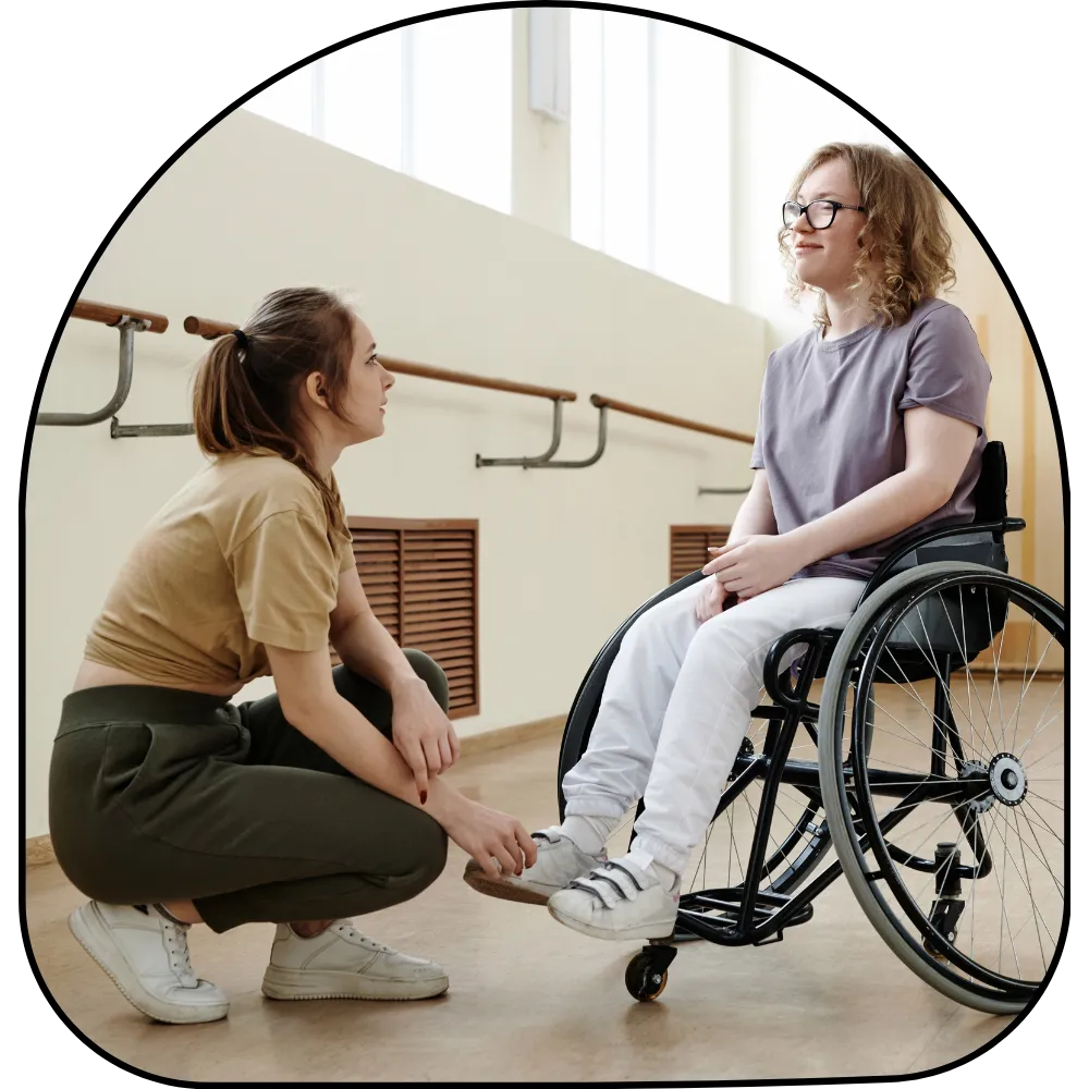 Disabled woman in wheelchair talking with friend